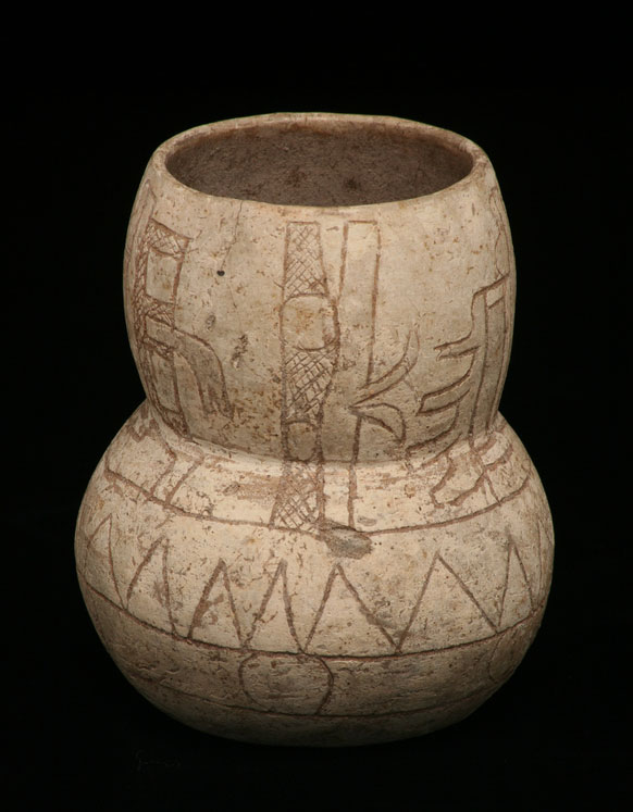 Carved white pottery vessel