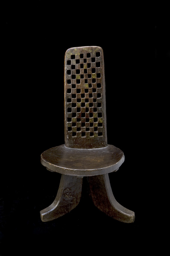 Ethiopian wood chair with openwork back having a cross design