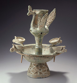 Oil lamp with a center bird surrounded by 4 oil bowls