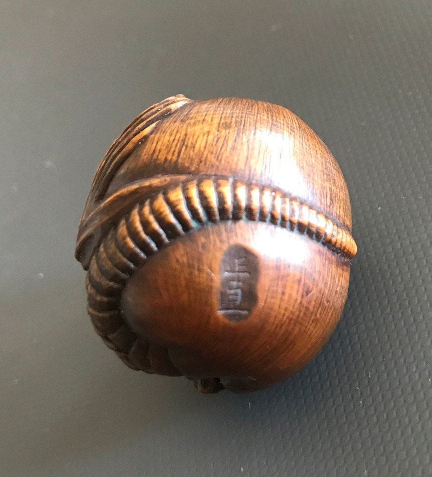 Wood netsuke of a coiled rat