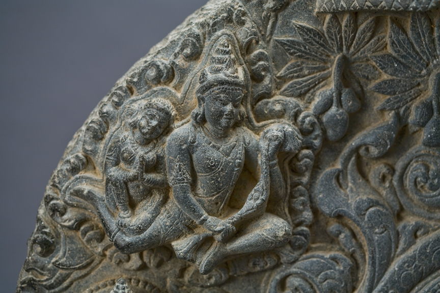 Prabha with two Buddhas on either side and aspara above