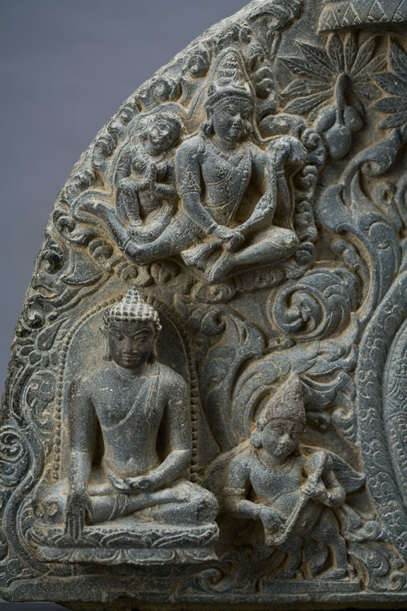 Prabha with two Buddhas on either side and aspara above